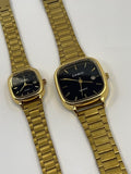 Gold square Casio watches with black dials and metal link bracelets
