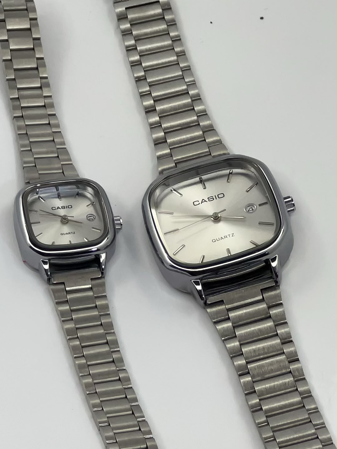 Gold square Casio watches with gold dials and metal link bracelets